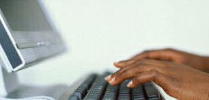 Fingers typing keyboard